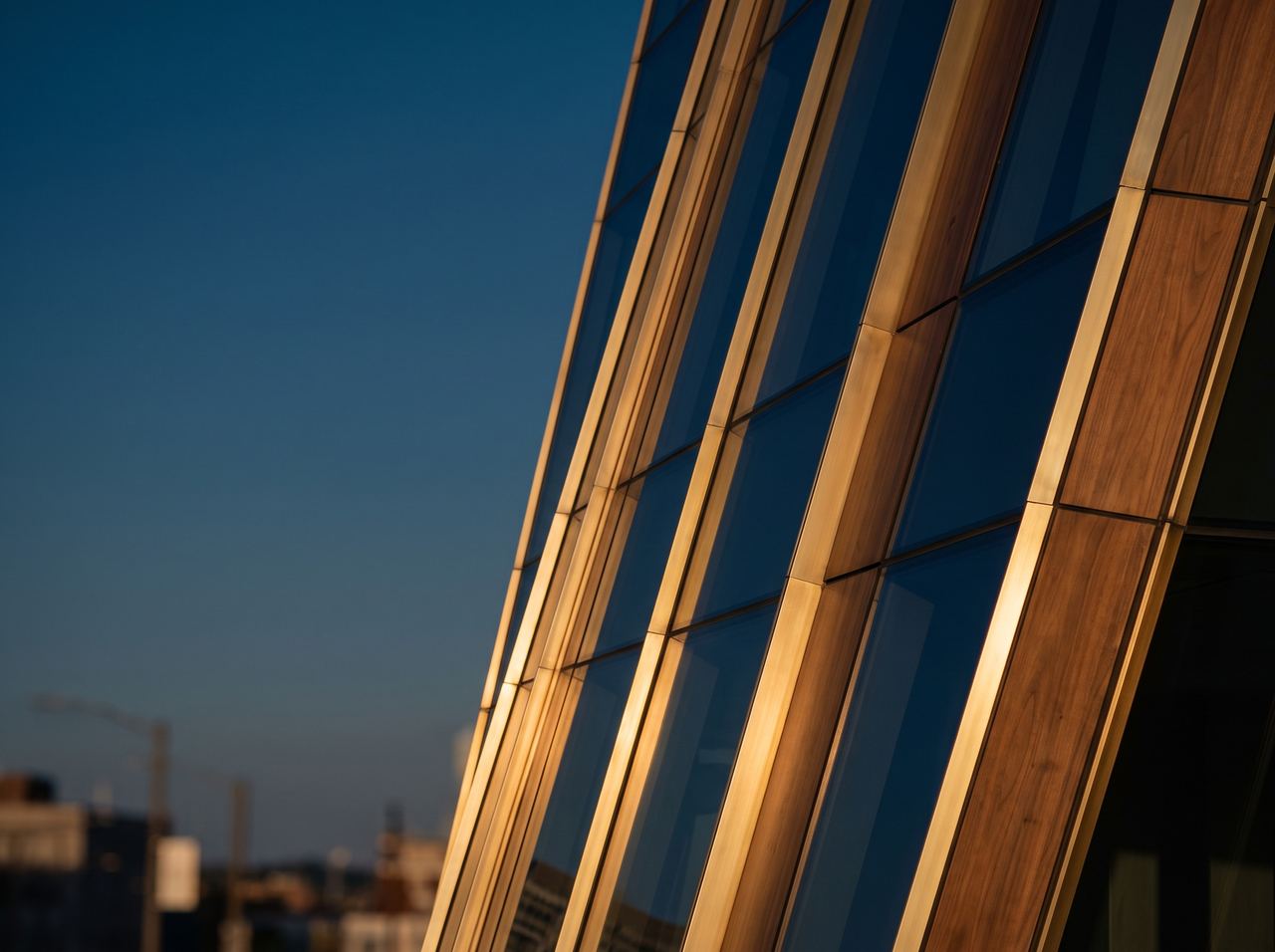 Ascending lines of a glass tower in evening light
